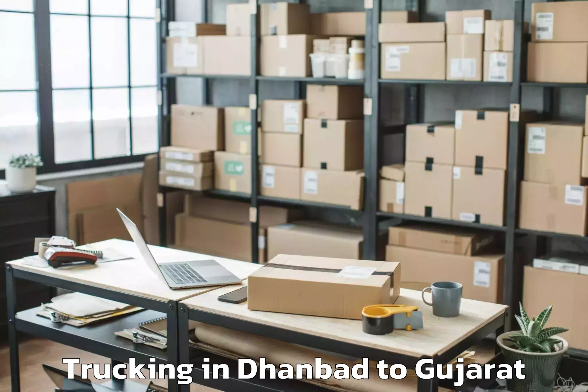 Trusted Dhanbad to Hemchandracharya North Gujarat Trucking